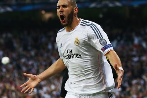 MADRID, SPAIN - APRIL 23:  Karim Benzema of Real Madrid celebrates scoring the opening goal during the UEFA Champions League semi-final first leg match between Real Madrid and FC Bayern Muenchen at the Estadio Santiago Bernabeu on April 23, 2014 in Madrid, Spain.  (Photo by Martin Rose/Bongarts/Getty Images)