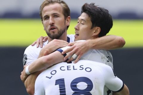 Tottenham's Harry Kane, center, celebrates with Giovanni Lo Celso and Son Heung-min after scoring his side's second goal during the English Premier League soccer match between Tottenham Hotspur and Leicester City, at the Tottenham Hotspur Stadium in London, Sunday, July 19, 2020. (Richard Heathcote/Pool Photo via AP)