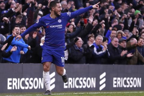 Chelsea's Eden Hazard celebrates after scoring his side's third goal during the English Premier League soccer match between Chelsea and Huddersfield Town at Stamford Bridge stadium in London, Britain, Saturday, Feb. 2, 2019. (AP Photo/ Alastair Grant)