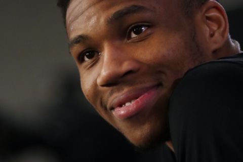 Milwaukee Bucks' Giannis Antetokounmpo smiles during a press conference ahead of the NBA basketball game against Charlotte Hornets, in Paris, Thursday, Jan. 23, 2020. (AP Photo/Thibault Camus)