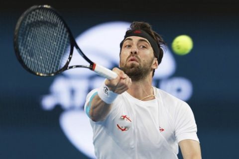 Nikoloz Basilashvili of Georgia plays a forehand to Pablo Cuevas of Uruguay during their match at the ATP Cup in Perth, Australia, Wednesday, Jan. 8, 2020. (AP Photo/Trevor Collens)