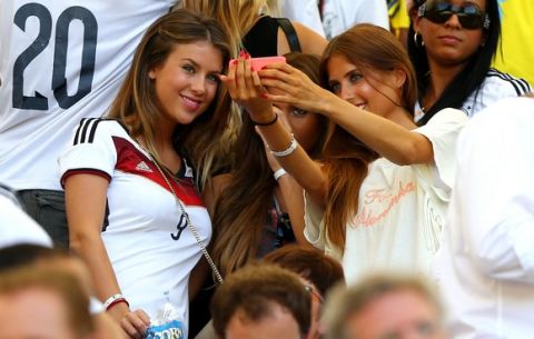 RIO DE JANEIRO, BRAZIL - JULY 04:  (L-R) Montana Yorke, girlfriend of Andre Schuerrle of Germany, Ann-Kathrin Brommel, girlfriend of Mario Gotze of Germany, and Cathy Fischer, girlfriend of Mats Hummels of Germany, take a selfie during the 2014 FIFA World Cup Brazil Quarter Final match between France and Germany at Maracana on July 4, 2014 in Rio de Janeiro, Brazil.  (Photo by Martin Rose/Getty Images)