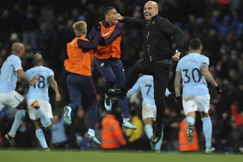 Manchester City manager Josep Guardiola celebrates after Manchester City's Raheem Sterling scored his side second goal during the English Premier League soccer match between Manchester City and Southampton at Etihad stadium, in Manchester, England, Wednesday, Nov. 29, 2017. (AP Photo/Rui Vieira)