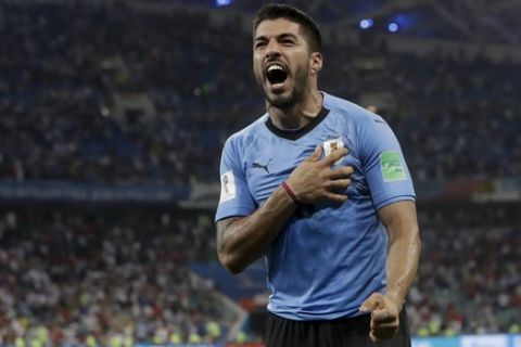 Uruguay's Luis Suarez celebrates after the round of 16 match between Uruguay and Portugal at the 2018 soccer World Cup at the Fisht Stadium in Sochi, Russia, Saturday, June 30, 2018. (AP Photo/Andre Penner)