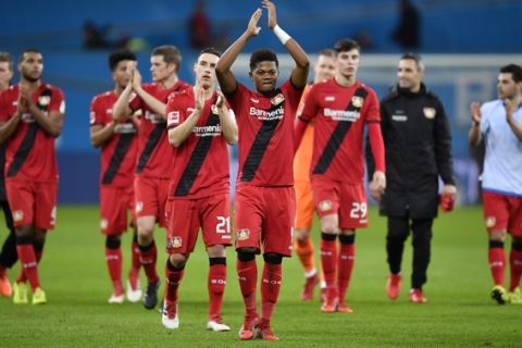 Leverkusen's Leon Bailey, center, celebrates with team and supporters after the German Bundesliga soccer match between Bayer Leverkusen and FSV Mainz in Leverkusen, Germany, Sunday, Jan. 28, 2018. Leverkusen defeated Mainz with 2-0. (AP Photo/Martin Meissner)