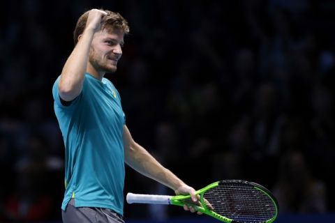 David Goffin of Belgium celebrates after defeating Dominic Thiem of Austria in their mens singles tennis match at the ATP World Finals at the O2 Arena in London, Friday, Nov. 17, 2017. (AP Photo/Alastair Grant)