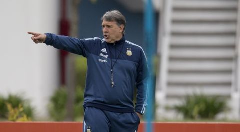 Argentina's coach Gerardo Martino directs his players during a training session in Buenos Aires, Argentina, Monday, Oct. 5, 2015. Argentina will face Ecuador for a 2018 World Cup Russia qualifier soccer match in Buenos Aires on October 8. (AP Photo/Natacha Pisarenko)