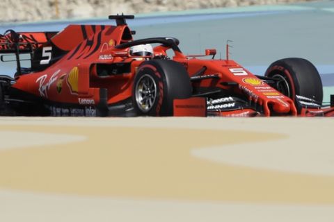 Ferrari driver Sebastian Vettel of Germany steers his car during the first free practice at the Formula One Bahrain International Circuit in Sakhir, Bahrain, Friday, March 29, 2019. The Bahrain Formula One Grand Prix will take place on Sunday. (AP Photo/Luca Bruno)