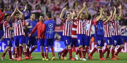Atletico Madrid players celebrate winning after the UEFA Champions League quarter final football match Club Atletico de Madrid vs Barcelona at the Vicente Calderon stadium in Madrid on April 9, 2014.     AFP PHOTO / JAVIER SORIANO        (Photo credit should read JAVIER SORIANO/AFP/Getty Images)