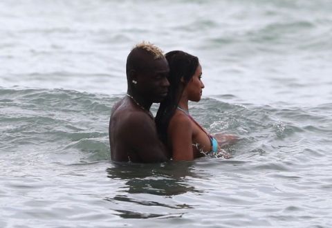 US & UK CLIENTS MUST ONLY CREDIT KDNPIX<BR/>
Italian footballer Mario Balotelli and his fiancee Fanny Neguesha spend a day at the beach as they continue their vacation in Miami following Italy's elimination from the 2014 FIFA World Cup in Brazil.
<P>
Pictured: Mario Balotelli and Fanny Neguesha
<P><B>Ref: SPL796934  060714  </B><BR/>
Picture by: KDNPIX / Splash News<BR/>
</P><P>
<B>Splash News and Pictures</B><BR/>
Los Angeles:	310-821-2666<BR/>
New York:	212-619-2666<BR/>
London:	870-934-2666<BR/>
photodesk@splashnews.com<BR/>
</P>