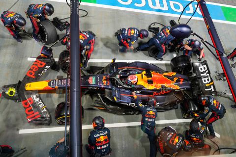 Red Bull driver Max Verstappen of the Netherlands waits in pit lane as his mechanics change his tires during the Singapore Formula One Grand Prix at the Marina Bay circuit, Singapore,Sunday, Sept. 17, 2023. (AP Photo/Vincent Thian)