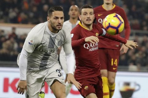 Inter Milan's Danilo D'Ambrosio, left, challenges for the ball with Roma's Alessandro Florenzi during the Serie A soccer match between Roma and Inter Milan at the Rome Olympic stadium, Sunday, Dec. 2, 2018. (AP Photo/Andrew Medichini)