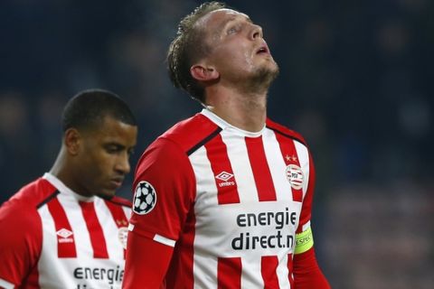 PSV's Luuk de Jong, right, and Luciano Narsingh react after the Group D Champions League soccer match between PSV and Rostov at the PSV stadium in Eindhoven, Netherlands, Tuesday, Dec. 6, 2016. (AP Photo/Peter Dejong)