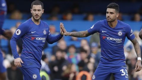 Chelsea's Eden Hazard, left, celebrates with Chelsea's Emerson after scoring his side's opening goal during the English Premier League soccer match between Chelsea and Wolverhampton Wanderers at Stamford Bridge stadium in London, Sunday, March 10, 2019. (AP Photo/Matt Dunham)