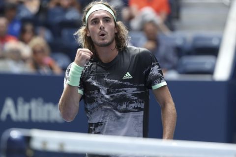 Stefanos Tsitsipas, of Greece, reacts after scoring a point against Andrey Rublev, of Russia, during the first round of the US Open tennis tournament Tuesday, Aug. 27, 2019, in New York. (AP Photo/Kevin Hagen)