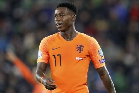 FILE - Netherlands' Quincy Promes looks on during the Euro 2020 group C qualifying soccer match between Northern Ireland and the Netherlands at Windsor Park, Belfast, Northern Ireland, Saturday, Nov. 16, 2019. On Friday, March 3, 2023, prosecutors urged a Dutch court to convict Netherlands international Quincy Promes of aggravated assault and sentence him to two years imprisonment for allegedly stabbing his nephew in the knee at a party. (AP Photo/Peter Morrison, File)