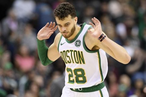 Boston Celtics guard RJ Hunter reacts after he made a3-point basket during the second half of the team's NBA basketball game against the Washington Wizards, Tuesday, April 9, 2019, in Washington. The Celtics won 116-110. (AP Photo/Nick Wass)