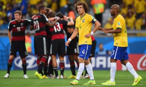 BELO HORIZONTE, BRAZIL - JULY 08:  David Luiz and Maicon of Brazil react after allowing a goal during the 2014 FIFA World Cup Brazil Semi Final match between Brazil and Germany at Estadio Mineirao on July 8, 2014 in Belo Horizonte, Brazil.  (Photo by Laurence Griffiths/Getty Images)