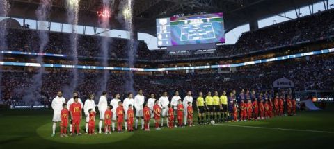 Real Madrid, left, and Barcelona, right, stand on the field at Hard Rock Stadium before an International Champions Cup soccer match, Saturday, July 29, 2017, in Miami Gardens, Fla. (AP Photo/Lynne Sladky)