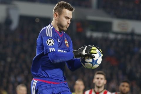 CSKA's goalkeeper Igor Akinfeev saves during the Champions League Group B soccer match between PSV and CSKA Moscow at the Philips stadium in Eindhoven, Netherlands, Tuesday, Dec. 8, 2015. (AP Photo/Peter Dejong)