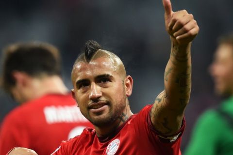 MUNICH, GERMANY - NOVEMBER 24: Arturo Vidal of Bayern Muenchen celebrates victory after the UEFA Champions League group F match between FC Bayern Munchen and Olympiacos FC at the Allianz Arena on November 24, 2015 in Munich, Germany.  (Photo by Matthias Hangst/Bongarts/Getty Images)