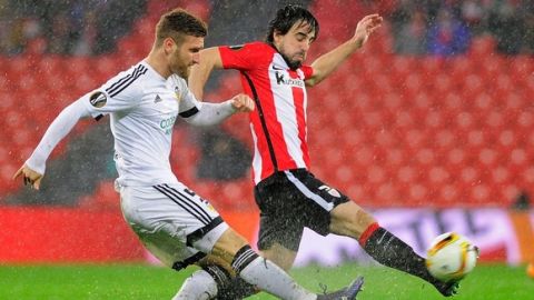 "Valencia's German defender Shkodran Mustafi (L) vies with Athletic Bilbao's midfielder Benat Etxebarria during the UEFA Europa League Round of 16 first leg football match Athletic Club Bilbao vs Valencia CF at the San Mames stadium in Bilbao on March 10, 2016.   / AFP / ANDER GILLENEA        (Photo credit should read ANDER GILLENEA/AFP/Getty Images)"