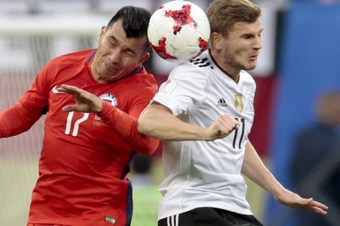 Chile's Gary Medel, left, and Germany's Timo Werner vie for the ballduring the Confederations Cup final soccer match between Chile and Germany, at the St.Petersburg Stadium, Russia, Sunday July 2, 2017. (AP Photo/Ivan Sekretarev)