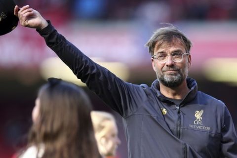 Liverpool manager Juergen Klopp greets supporters at the end of the English Premier League soccer match between Liverpool and Wolverhampton Wanderers at the Anfield stadium in Liverpool, England, Sunday, May 12, 2019. Despite a 2-0 win over Wolverhampton Wanderers, Liverpool missed out on becoming English champion for the first time since 1990 because title rival Manchester City beat Brighton 4-1. (AP Photo/Dave Thompson)