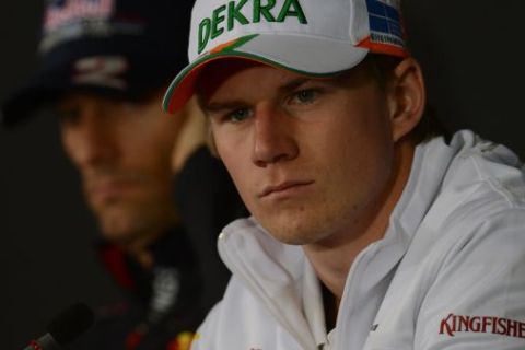 (L to R) Red Bull Racing's Australian driver Mark Webber and Force India's German driver Nico Hulkenberg sit during a press conference at the Hockenheimring circuit on July 19, 2012 in Hockenheim ahead of the Formula One German Grand Prix.  AFP PHOTO / DIMITAR DILKOFF