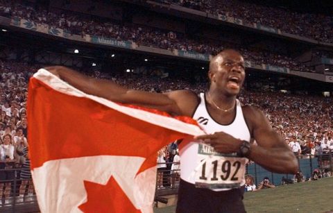 Donovan Bailey of Canada celebrates after winning the gold medal in the men's 100 meter final at the 1996 Summer Olympics in Atlanta, Saturday, July 27, 1996.  (AP Photo/Ed Reinke)