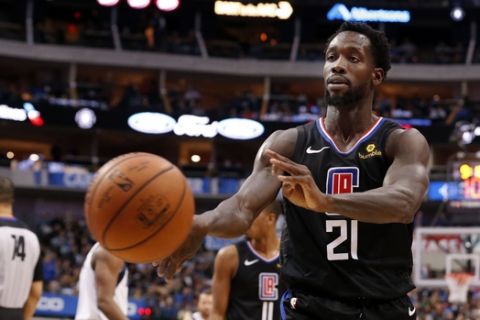 Los Angeles Clippers guard Patrick Beverley (21) throws a ball at a fan during the second half of an NBA basketball game against the Dallas Mavericks in Dallas, Sunday, Dec. 2, 2018. Dallas won 114-110. Beverley was ejected from the game. (AP Photo/Michael Ainsworth)