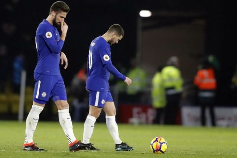 Chelsea's Olivier Giroud, left, and Chelsea's Eden Hazard look dejected after their team lost the English Premier League soccer match between Watford and Chelsea at Vicarage Road stadium in London, Monday, Feb. 5, 2018.(AP Photo/Frank Augstein)