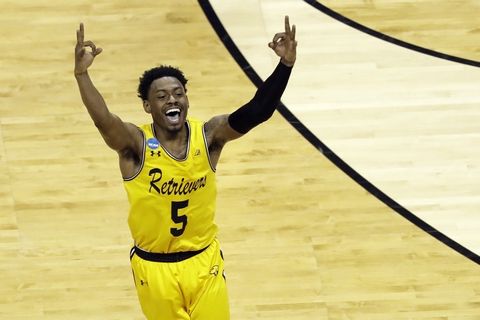 UMBC's Jourdan Grant celebrates after a basket against Virginia during the second half of a first-round game in the NCAA men's college basketball tournament in Charlotte, N.C., Friday, March 16, 2018. (AP Photo/Chuck Burton)