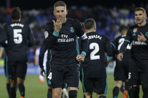 Real Madrid's Sergio Ramos blows a kiss as he celebrates after scoring his side's third goal during a Spanish La Liga soccer match between Real Madrid and Leganes at the Butarque stadium in Leganes, outside Madrid, Wednesday, Feb. 21, 2018. Real Madrid won 3-1.  (AP Photo/Francisco Seco)
