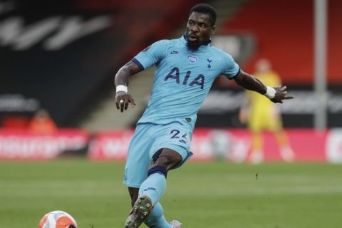 Tottenham's Serge Aurier kicks the ball during the English Premier League soccer match between Bournemouth and Tottenham at the Vitality Stadium in Bournemouth, England, Thursday, July 9, 2020. (AP Photo/Matt Dunham, Pool)