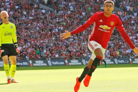 Manchester United's Jesse Lingard celebrates after scoring during the Community Shield soccer match between Leicester and Manchester United at Wembley stadium in London, Sunday, Aug. 7, 2016 . (AP Photo/Frank Augstein)