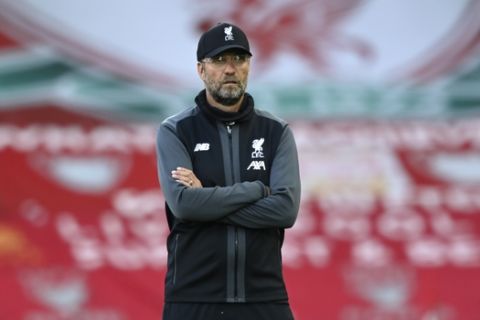 Liverpool's manager Jurgen Klopp stands on the pitch before the English Premier League soccer match between Liverpool and Crystal Palace at Anfield Stadium in Liverpool, England, Wednesday, June 24, 2020. (Shaun Botterill/Pool via AP)