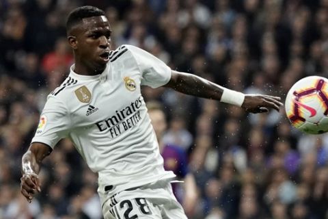 Real forward Vinicius Junior goes to the ball during the Spanish La Liga soccer match between Real Madrid and FC Barcelona at the Bernabeu stadium in Madrid, Saturday, March 2, 2019. (AP Photo/Andrea Comas)