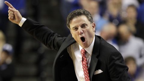 Kentucky's head coach Rick Pitino urges on his team during the second half of an NCAA college basketball game against Louisville, Saturday, Dec. 28, 2013, in Lexington, Ky. Kentucky won 73-66. (AP Photo/James Crisp)