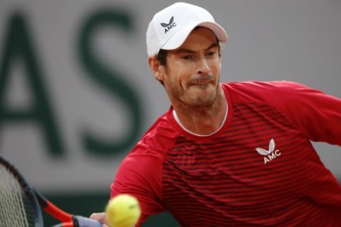 Britain's Andy Murray plays a shot against Switzerland's Stan Wawrinka in the first round match of the French Open tennis tournament at the Roland Garros stadium in Paris, France, Sunday, Sept. 27, 2020. (AP Photo/Christophe Ena)