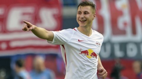 Leipzig's Willi Orban celebrates after scoring a goal during the German first division Bundesliga soccer match between RB Leipzig and SV Darmstadt 98 in Leipzig, Germany, Saturday, April 1, 2017. (AP Photo/Jens Meyer)