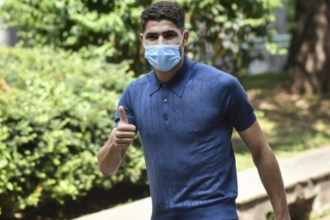 Real Madrid player Achraf Hakimi arrives at the CONI offices in Milan to undergo medical tests before signing for Inter Milan, Italy, Tuesday, June 30, 2020.  (Claudio Furlan/LaPresse via AP)