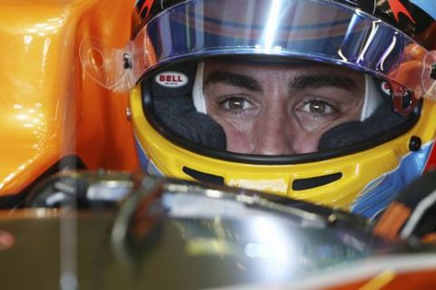 McLaren driver Fernando Alonso of Spain waits in his car during the final practice session for the Australian Formula One Grand Prix in Melbourne, Australia, Saturday, March 25, 2017. (AP Photo/Rick Rycroft)