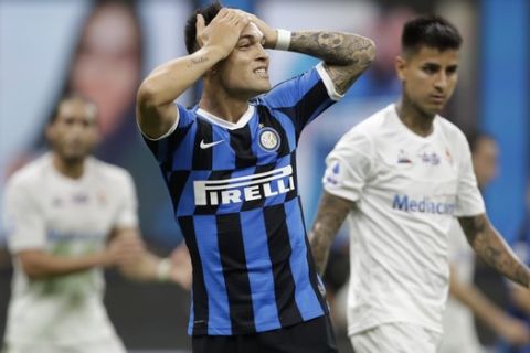 Inter Milan's Lautaro Martinez reacts after a missed scoring opportunity during a Serie A soccer match between Inter Milan and Fiorentina, at the San Siro stadium in Milan, Italy, Wednesday, July 22, 2020. (AP Photo/Luca Bruno)