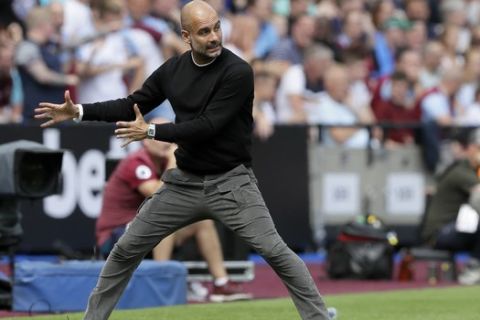 Manchester City's head coach Pep Guardiola gestures during the English Premier League soccer match between West Ham United and Manchester City at London stadium in London, Saturday, Aug. 10, 2019. (AP Photo/Kirsty Wigglesworth)