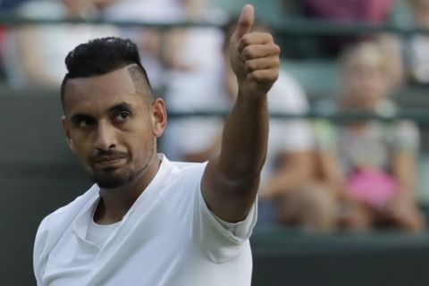 Nick Kyrgios of Australia gestures to the players' box during their men's singles match against Kei Nishikori of Japan on the sixth day at the Wimbledon Tennis Championships in London, Saturday July 7, 2018. (AP Photo/Ben Curtis)