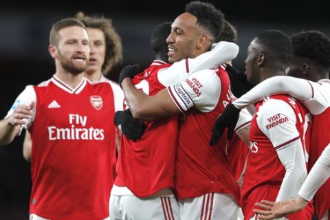Arsenal's Pierre-Emerick Aubameyang celebrates after scoring his side's first goal during the English Premier League soccer match between Arsenal and Newcastle at the Emirates Stadium in London, Sunday, Feb. 16, 2020.(AP Photo/Frank Augstein)
