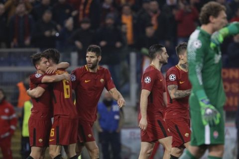 Roma players celebrate after Edin Dzeko scored his side's opening goal during a Champions League round of 16 second-leg soccer match between Roma and Shakhtar Donetsk, at the Rome Olympic stadium, Tuesday, March 13, 2018. (AP Photo/Gregorio Borgia)