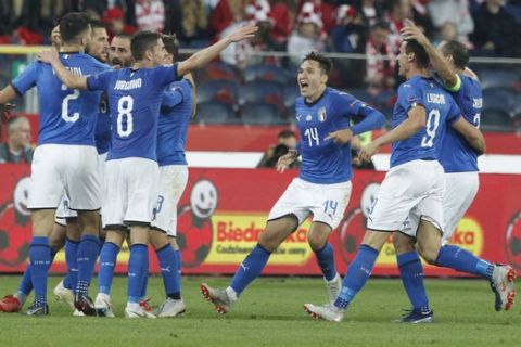 Italy players celebrate after their teammate Cristiano Biraghi scored during the UEFA Nations League soccer match between Poland and Italy at the Silesian Stadium Chorzow, Poland, Sunday Oct. 14, 2018. Italy won 1.0. (AP Photo/Czarek Sokolowski)