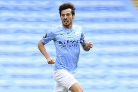 Manchester City's David Silva runs during the English Premier League soccer match between Manchester City and Norwich City at the Etihad Stadium in Manchester, England, Sunday, July 26, 2020. (Peter Powelll/Pool via AP)